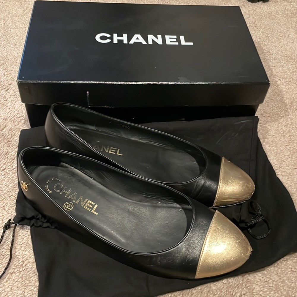 Chanel black ballet flats with gold toe